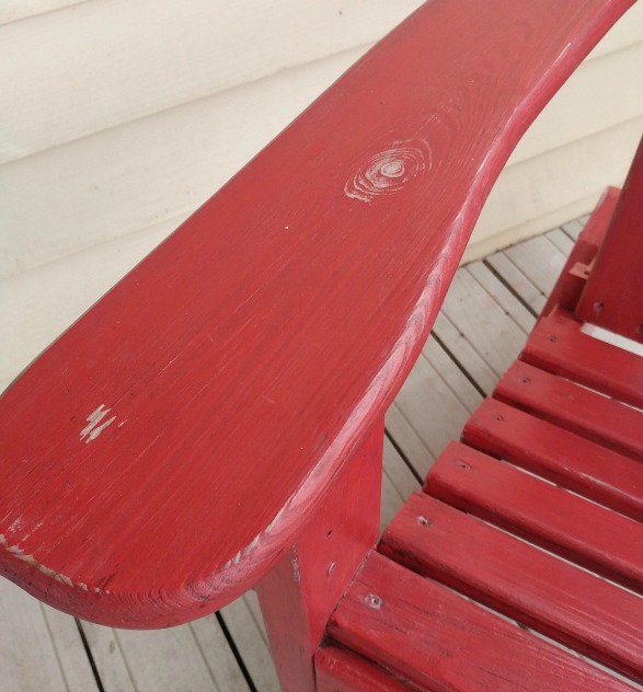 Distressing on Adirondack rocking chair.