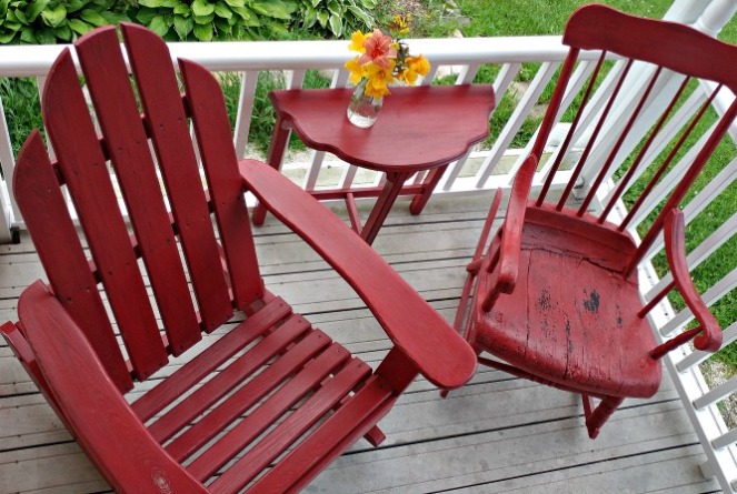 Adirondack chair and spindle rocker get a coat of bright red paint.